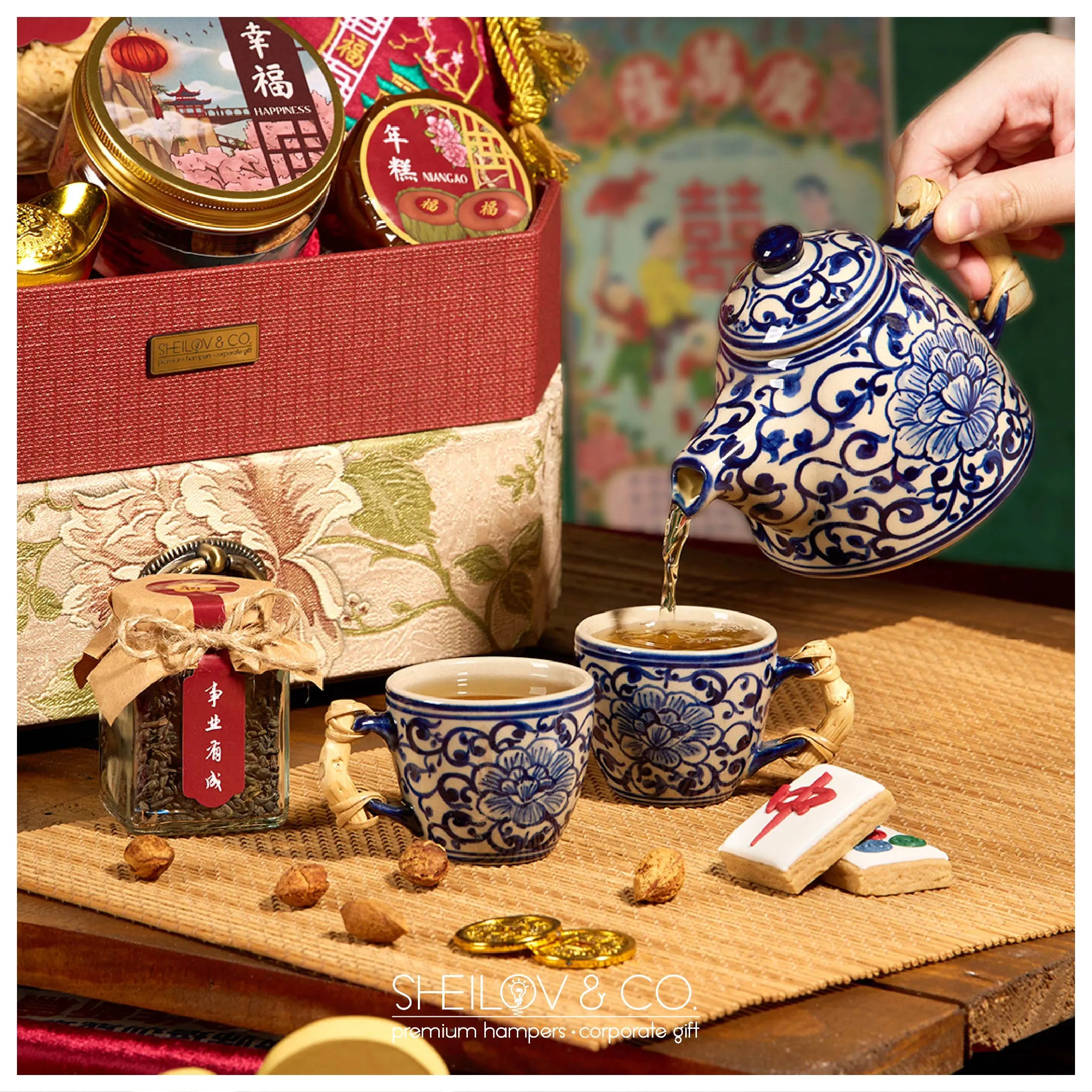 Tea being poured beside a Sheilov Chinese New Year hamper